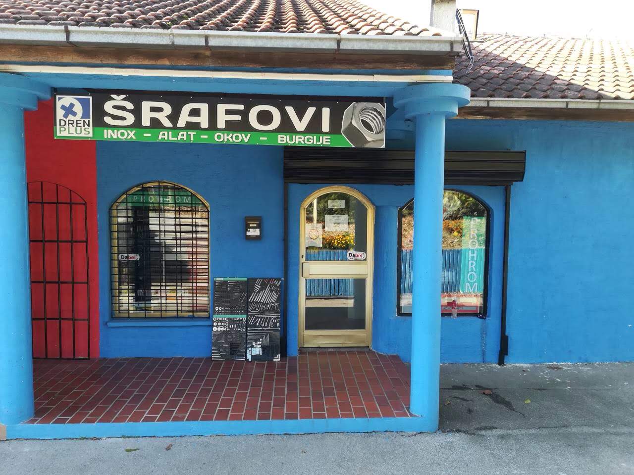 Plava fasada i ulaz sa natpisom Dren Plus, Šrafovi, Inox, Alat, Okov, Burgije